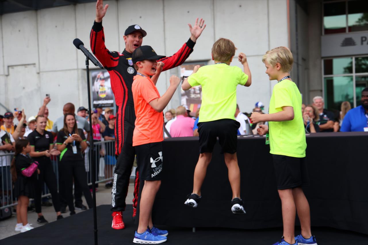 Ryan Hunter-Reay and his sons celebrate the first qualification slot - Indianapolis 500 Practice - By: Tim Holle -- Photo by: Tim Holle